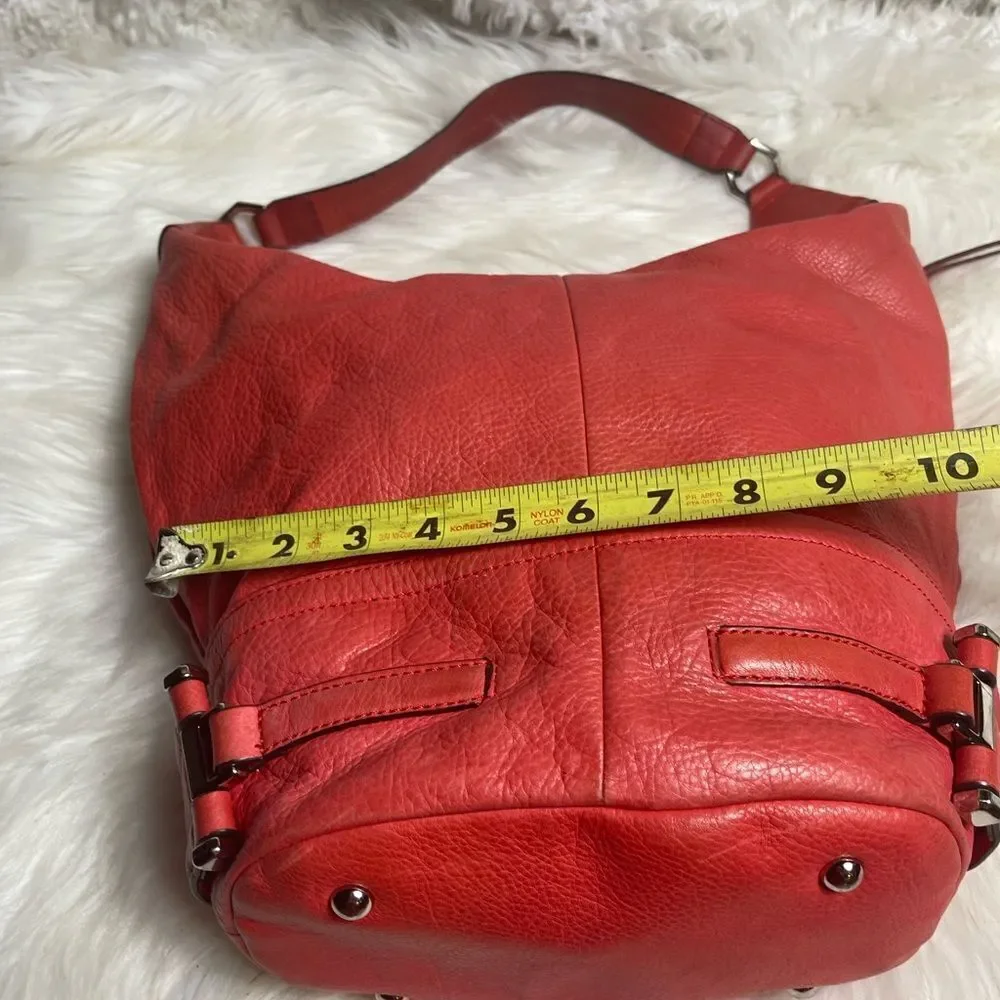 B Makowsky leather orange Hobo bucket style shoulder bag  silver tone hardwares